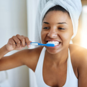 woman brushing her teeth