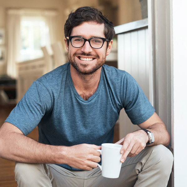 man with glasses smiling